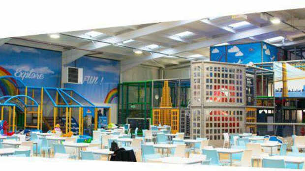 Indoor soft play frames and cafe area at Big Apple Play in Rotherham