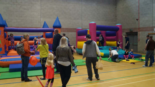 Kids on bouncy castle at Newburn Activity Centre in Newcastle Upon Tyne