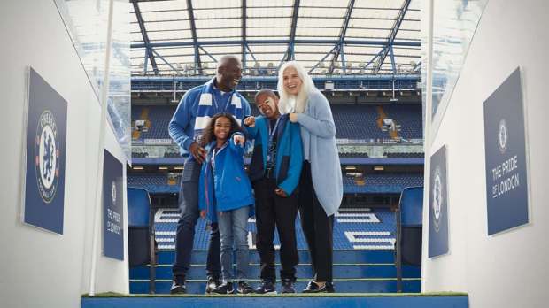 Chelsea FC tour guide leading visitors through Stamford Bridge, sharing club history and behind‑the‑scenes stories.