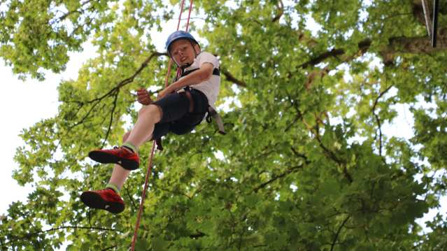 Boy on high ropes course at Live For Today Adventures Ripley