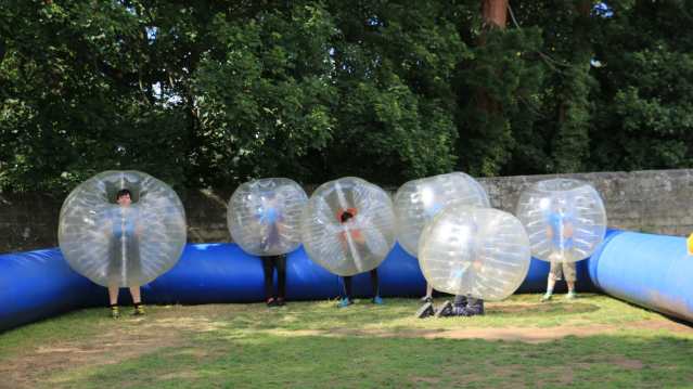 Kids in BodyZorbs play Bubble Football at Live For Today Adventures Ripley
