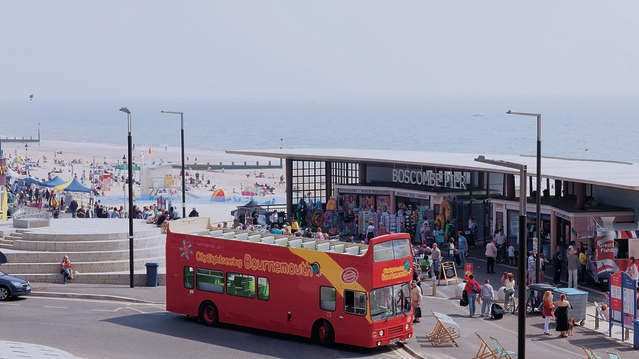City Sightseeing Bournemouth Hop on Hop off Tour bus at the beach