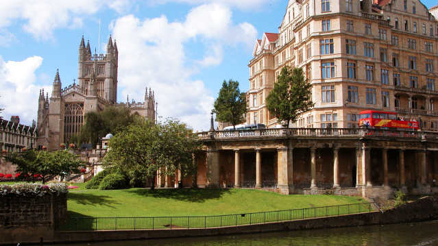 City Sightseeing Bath Hop on Hop off Tour bus passes gardens and Bath Abbey