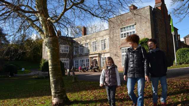 Family outside Cockington Court in Torquay