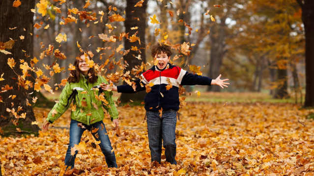 Kids playing with leaves at Supercamps in Shrewsbury