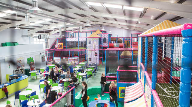 Indoor soft play frame and cafe area at Party and Play Funhouse in Bolton