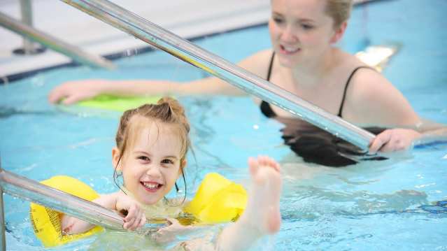 Girl with mum swimming at Brentford Fountain Leisure Centre in Brentford