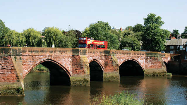 City Sightseeing Chester Hop On Hop Off Tour bus crossing bridge