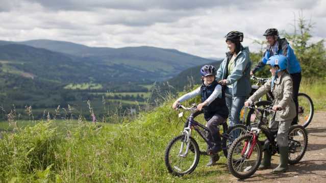 Family cycling at Highland Safaris in Aberfeldy