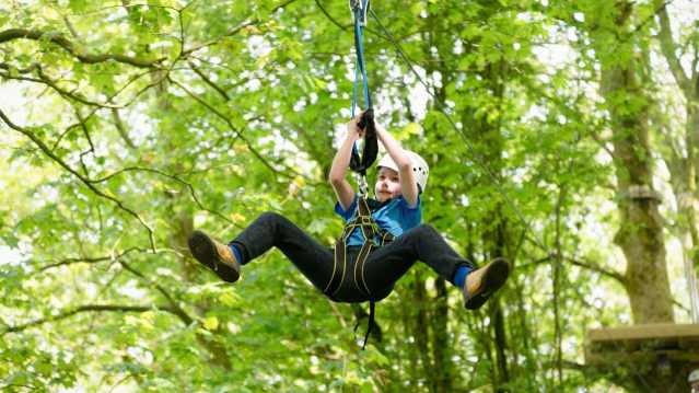 Boy on zip wire at Raven Tree Top Adventure in Skipton