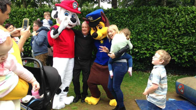 Family taking picture with mascots at Fort Evergreen in Warrenpoint