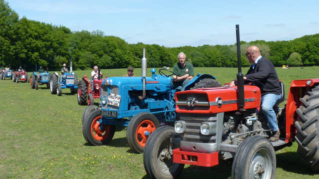 Men on tractors at Longdown Activity Farm in Ashurst
