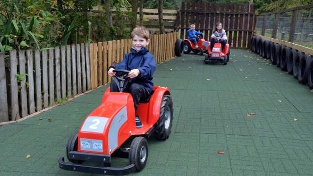 Kids on toy tractors at Palacerigg Country Park in Cumbernauld