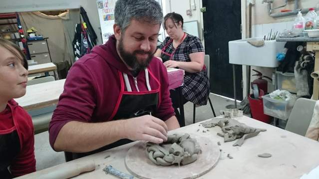 Dad and daughter in pottery class at Eastcott Studios in Swindon