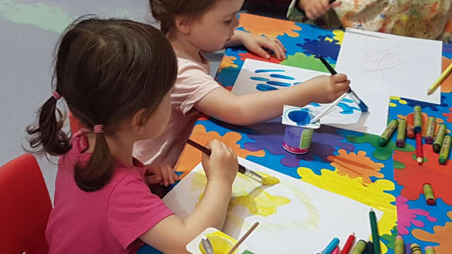 Girls painting at Polar Palace in Winsford