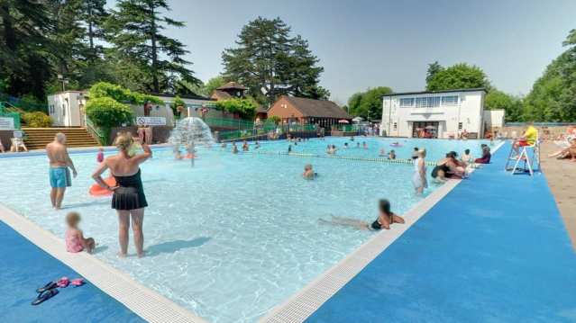 Families in outdoor swimming pool at Droitwich Spa Lido