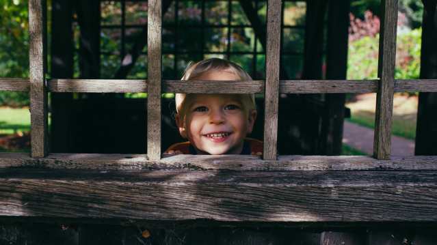 Boy in barn at Winterbourne House and Garden in Birmingham
