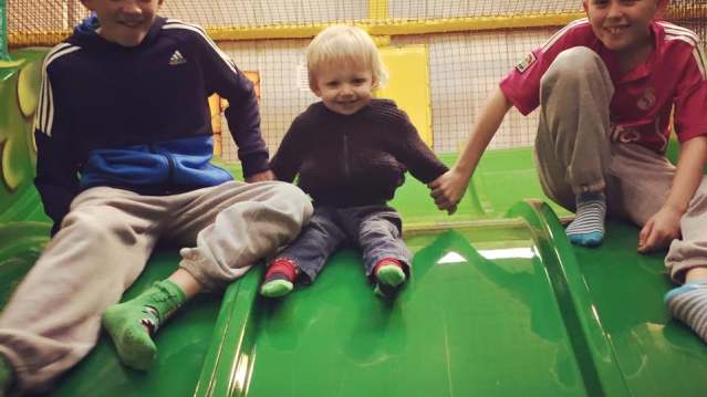 Kids on slide at Castle Mania Indoor Adventure Play in Amble