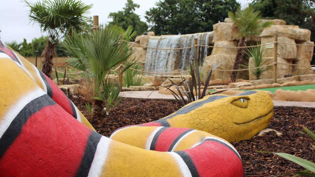Snake on golf course at Jungle Falls Adventure Golf in London