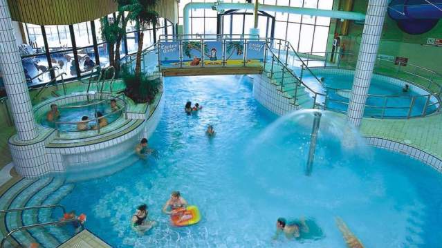 People swimming at The Quays Swimming and Diving Centre in Southampton