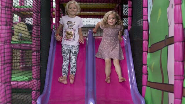 Girls on soft play slide at Pink Pig Farm in Scunthorpe