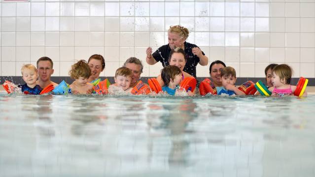 Toddlers in swimming lesson in pool at Northgate Arena in Chester