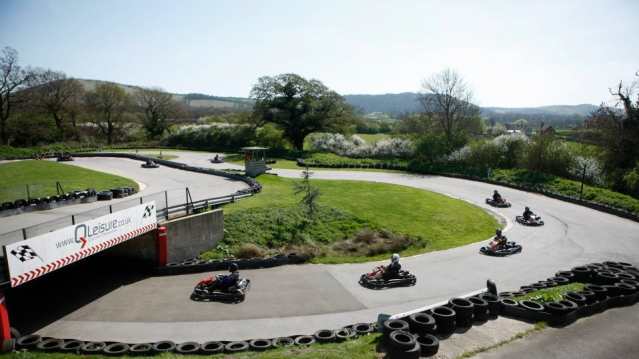 Kids racing on go karts at Q Leisure in Albourne