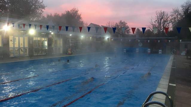People swimming at Chesham Heated Open Air Pool