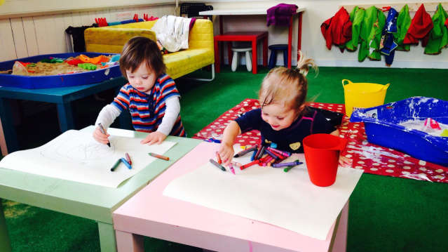 Girls colouring in activity room at The Art Garden in Accrington