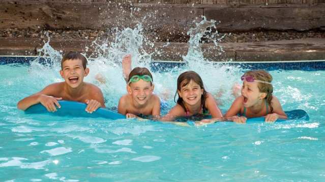 Kids on inflatable at Aqua Vale Swimming and Fitness Centre in Aylesbury