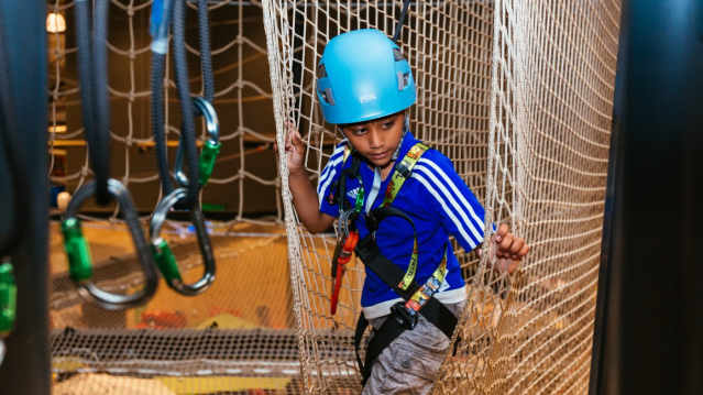 Boy on high ropes at Salt Hill Activity Centre in Slough