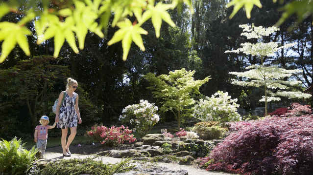 Mum and daughter walking at Samares Manor Playground in Jersey
