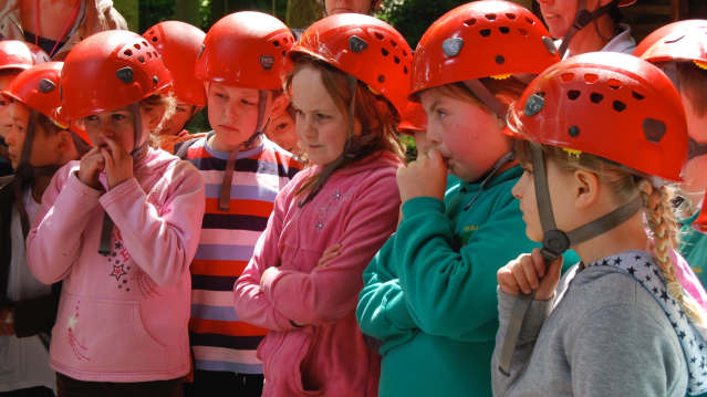 Girls listening to high ropes safety talk at Live For Today Adventures Kendal