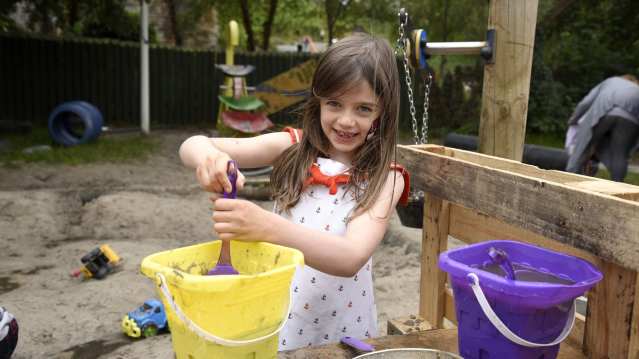 Girl play in sand pit at The Yard Stamford