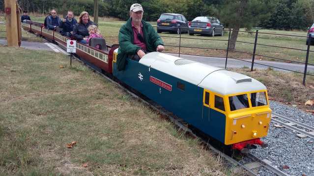 People on mini train at Barnards Miniature Railway in West Horndon