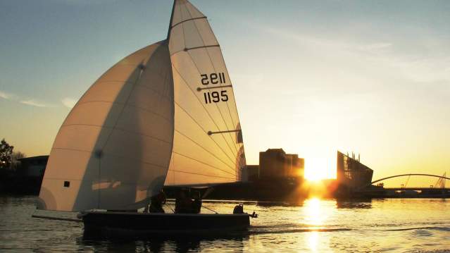 People sailing at Helly Hansen Watersports Centre in Salford