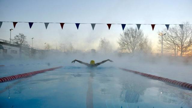 Man in outdoor swimming pool at Hampton Pool