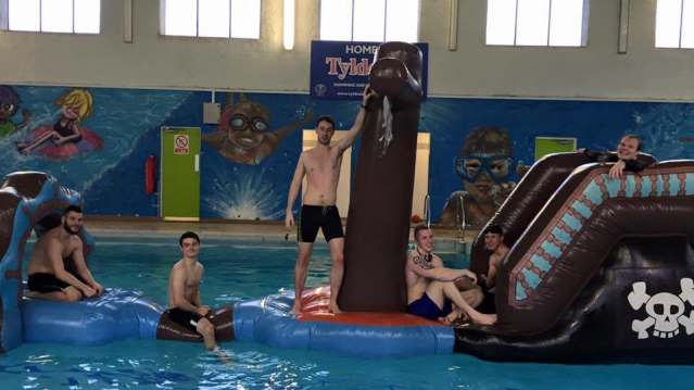 Boys on inflatable course at The Pelican Centre in Tyldesley