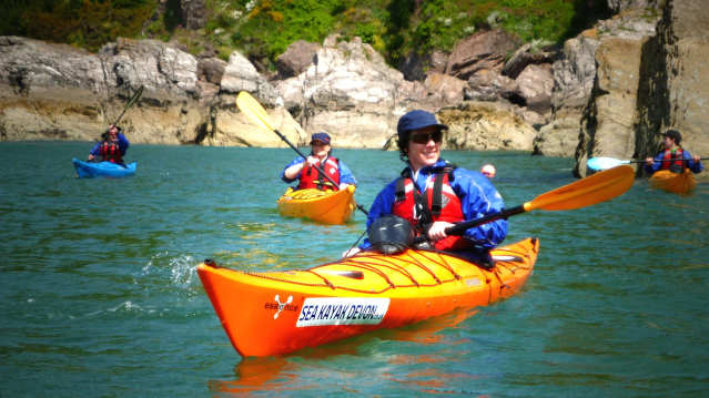 People kayaking at Sea Kayak Devon in Dartmouth