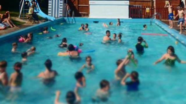 Families in outdoor swimming pool at Findon Swimming Pool in Worthing