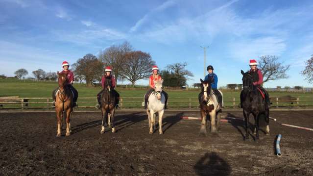 People on horses at Field House Equestrian Centre in Crook