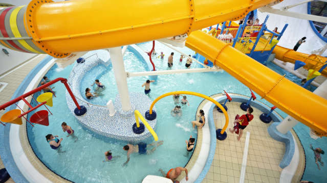 Families swimming at Huddersfield Leisure Centre Splash Park