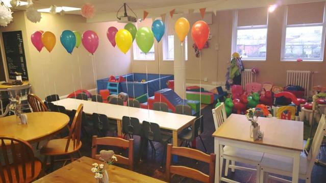 Dining tables and play area at The Little Play Cafe in South Shields