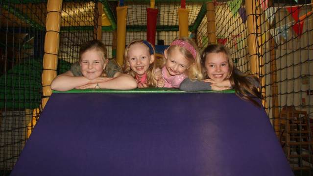 Girls on soft play slide at Jangala in Derby