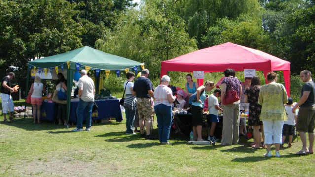 Visitors at stalls in Brickfields Country Park in Aldershot