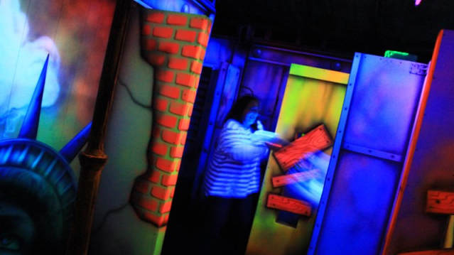 Woman playing laser tag at Lazer Fazer in Nelson