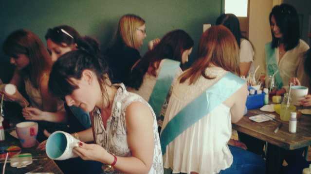 Girls making craft at Manic Ceramics in Hereford