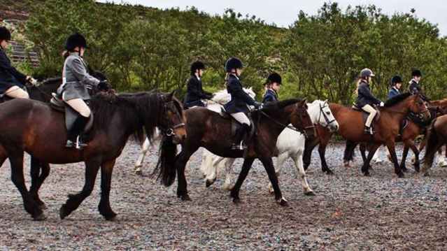 People riding horses at Matchmoor Riding Centre in Bolton