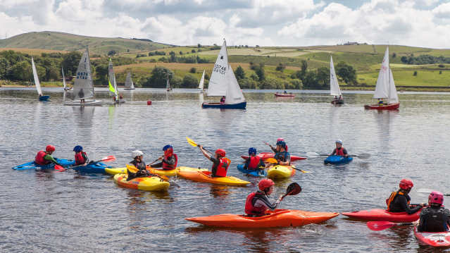 People kayaking at Hollingworth Lake Activity Centre in Littleborough