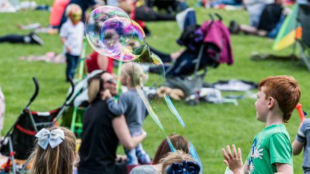 Kids blowing bubbles at Avenham and Miller Park in Preston